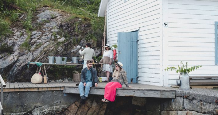 Enjoying a freshly prepared seafood meal by Norway's stunning fjord landscape.